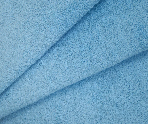 Бирюзовое махровое полотенце, текстура полотенца — стоковое фото