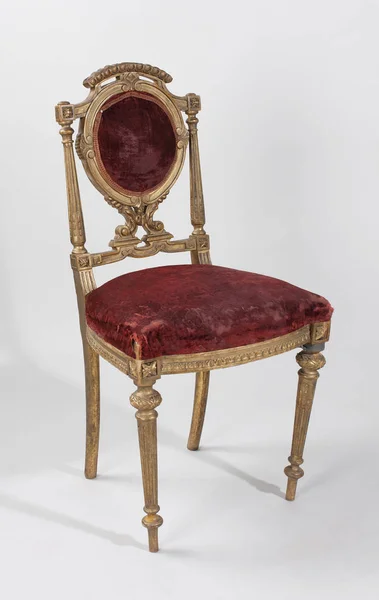 antique chair with velvet decoration, on white background