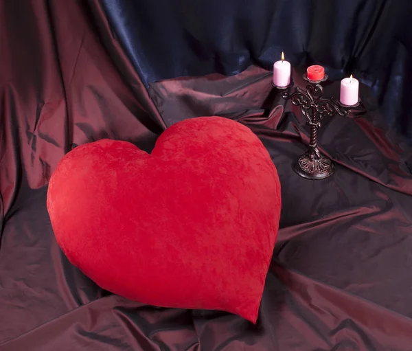 Red heart and candlestick with candles, abstraction for Valentin — Stock Photo, Image