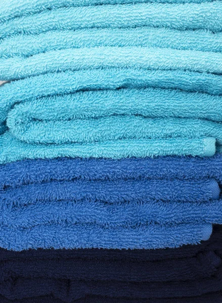 Stacked towels in different colors — Stock Photo, Image