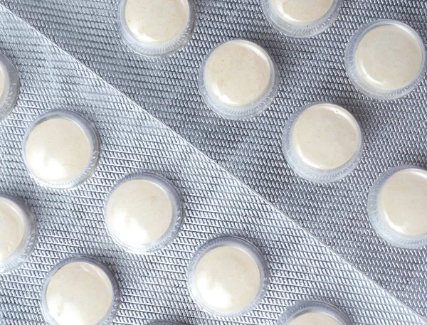 White tablets in a package — Stock Photo, Image