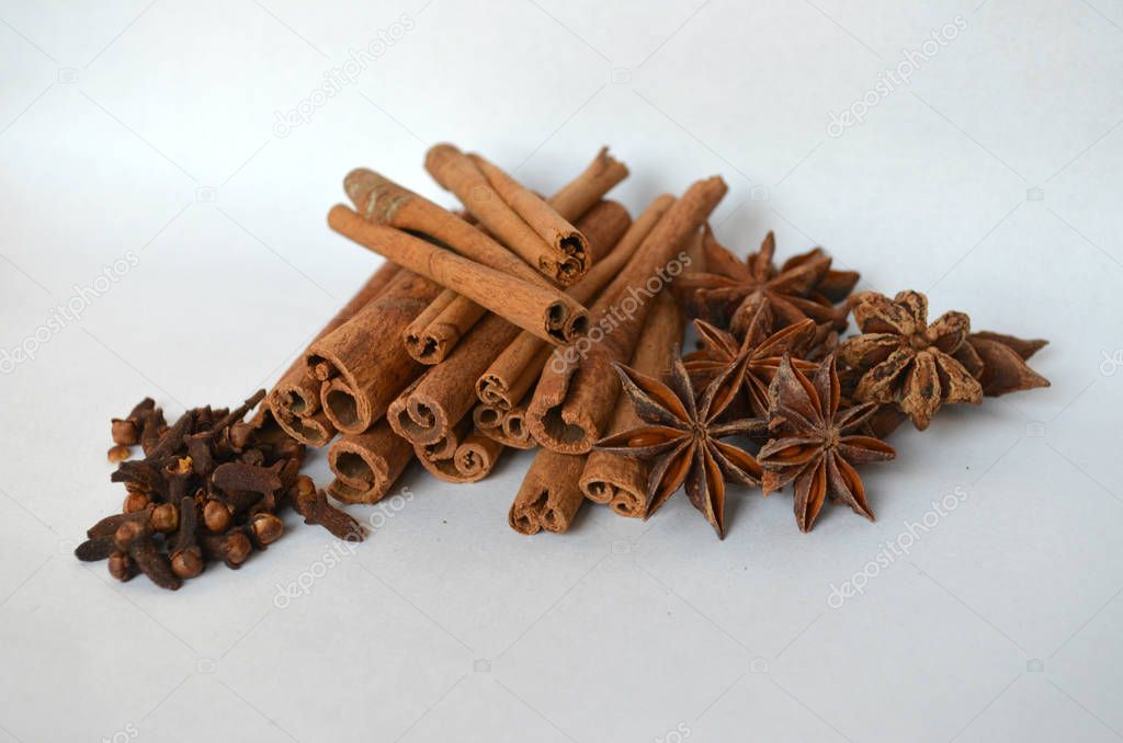 cinnamon, cloves and star anise spice on white background