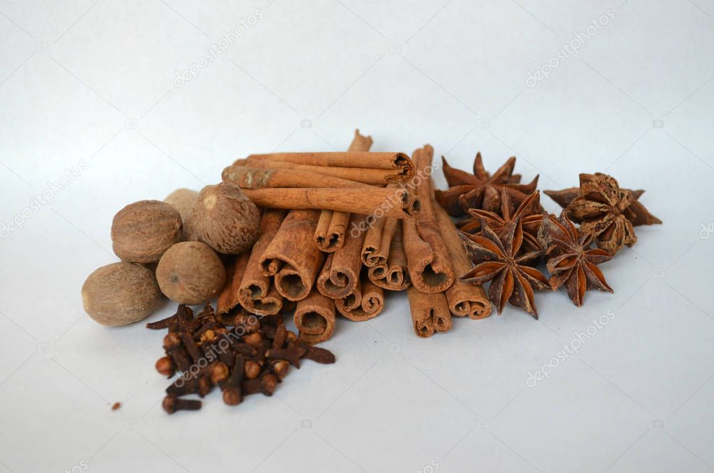 cinnamon, cloves, nutmeg and star anise spice on white background