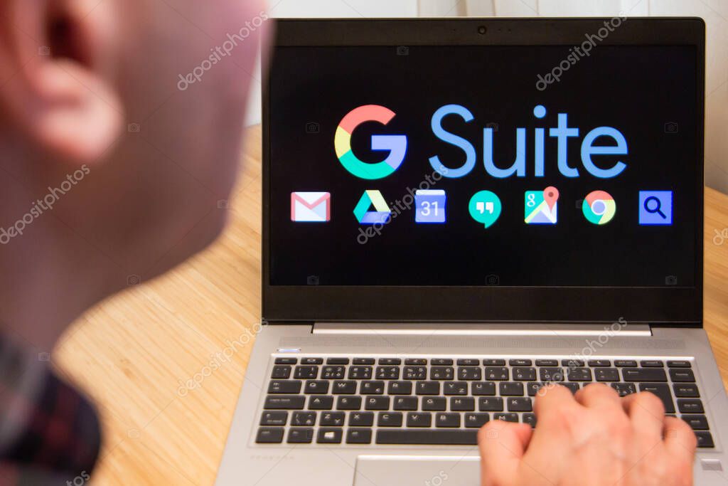 G suite is used by a man on the laptop. Microsoft customer used computer software. New product is tested by IT specialist. San Francisco, February 2020