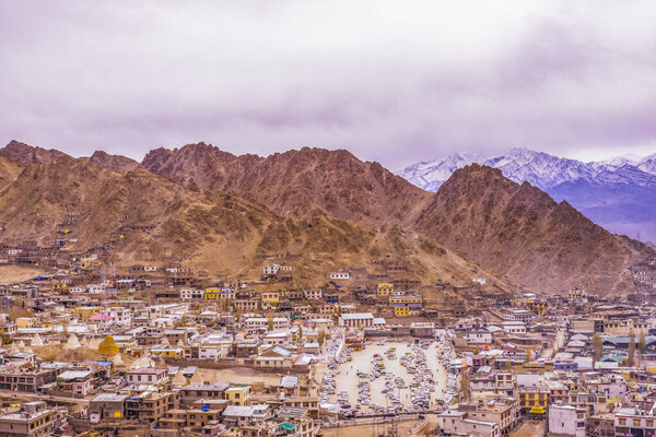 View landscape and cityscape of Leh Ladakh Village with Himalaya mountain range from viewpoint of Leh Stok Palace while winter season in Jammu and Kashmir, India
