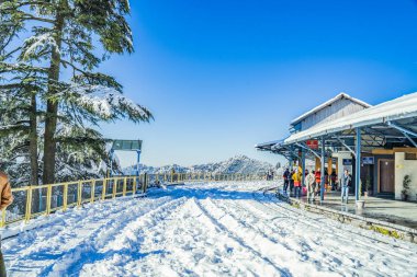 The scene from first snowfall in Shimla Railway Station India clipart