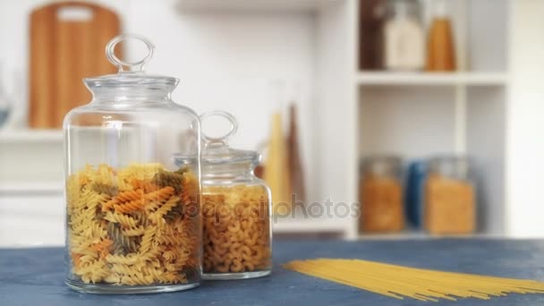 Pasta in glass jar on white background — Stock Video