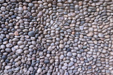 Taşlardan oluşmuş yüzeyi olan bir duvarın dokusu.