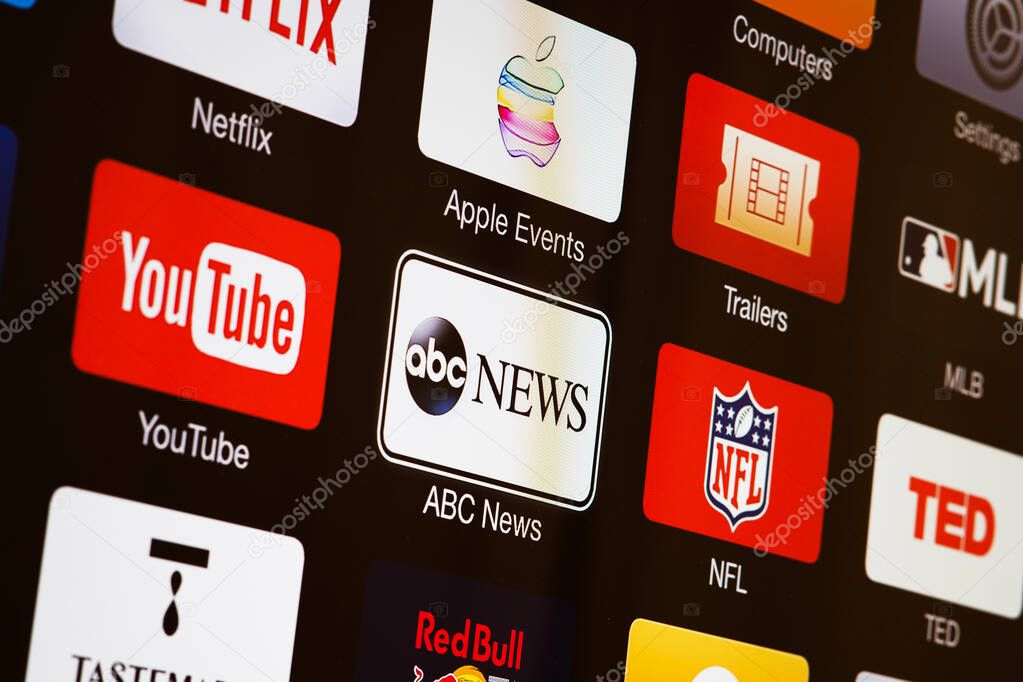 Miami / USA - March 17, 2020: Smart TV with icons of  video streaming services and apps: YouTube, ABC News, Tastemade, UFC, NFL, Crunchyroll, Flickr and Red Bull TV. News media on the screen