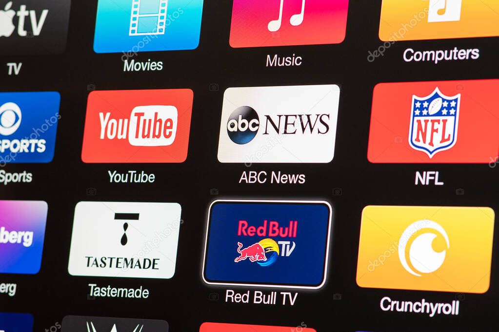 Miami / USA - March 17, 2020: Smart TV with icons of  video streaming services and apps: YouTube, ABC News, Tastemade, UFC, NFL, Crunchyroll, Flickr and Red Bull TV. News media on the screen