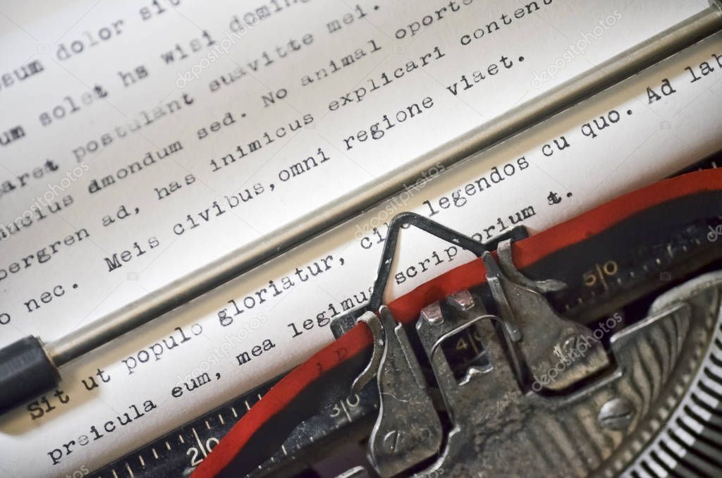 Close Up of Antique Typewriter with Ribbon Typing Lorem Ipsum