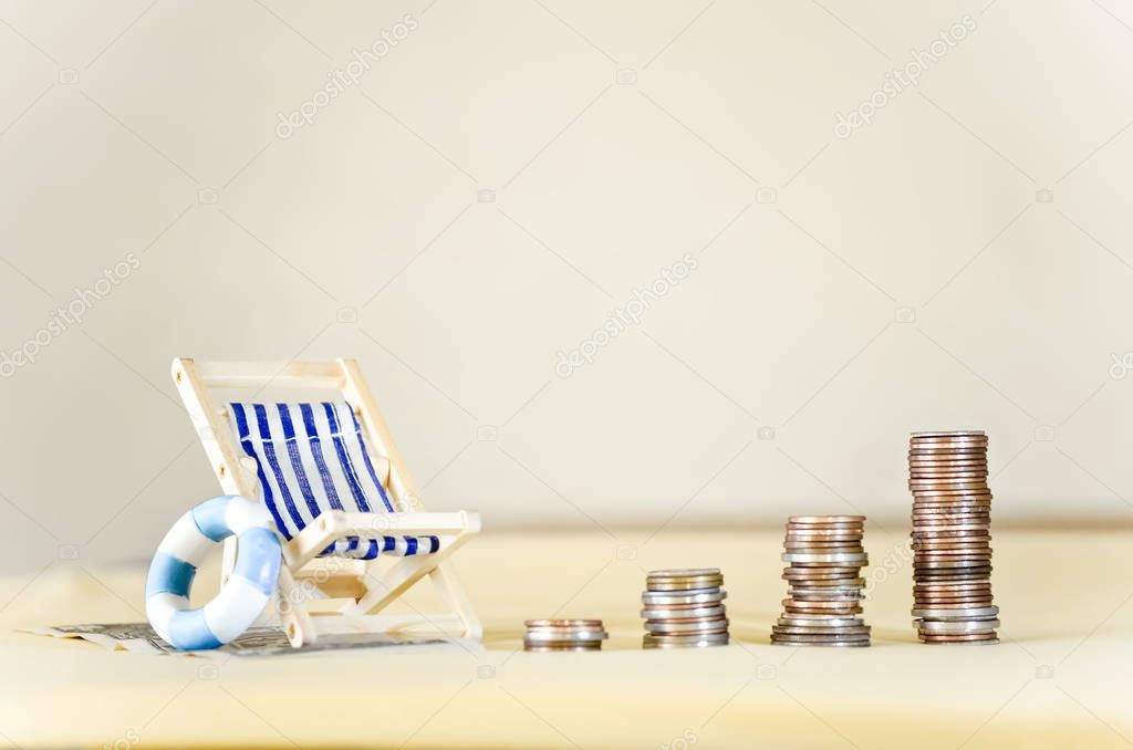 Miniature Beach Chair with Increasing Stacks of Coins
