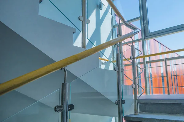 Stainless steel, glass and wood railing.Fall Protection. modern design of handrail and staircase