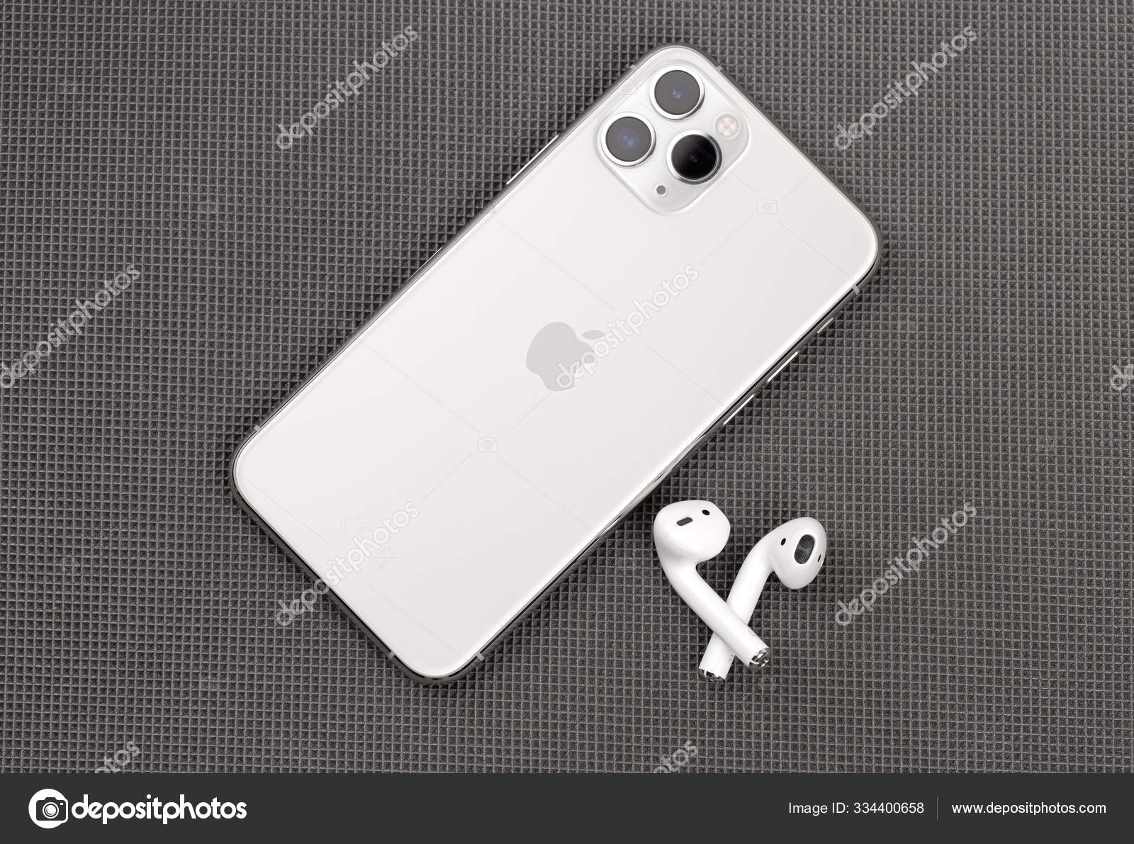 Apple Iphone 11 Pro Silver Color And Airpods On A Gray Surface Stock Editorial Photo C Seremin