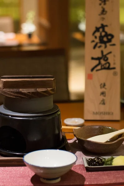 Grilled wagyu beef on miso sauce and a leaf on a small charcoal stove — ストック写真