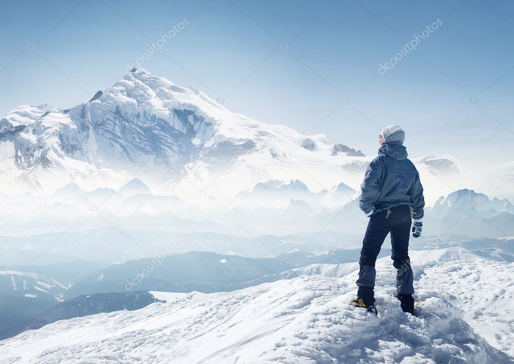 Tourist on the peak of high rocks