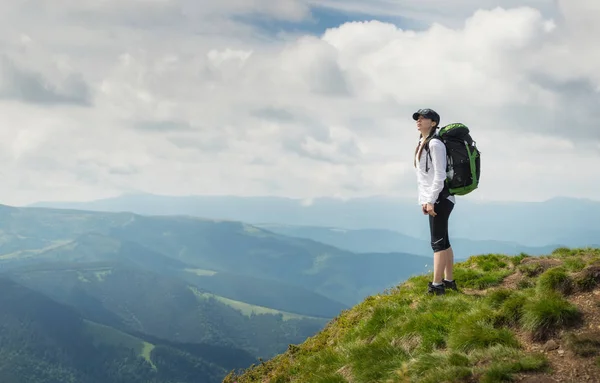 Tourist relax on the mountain top. Sport and active life concept