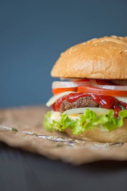 Arka plan olarak Burger. Kavram ve lezzetli yiyecek fikrine