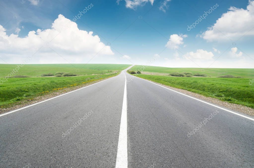 Road and cloudy sky. Beautiful natural concept and idea of travel