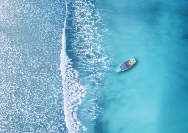 aerial view of boat floating in azure ocean in summer time  clipart