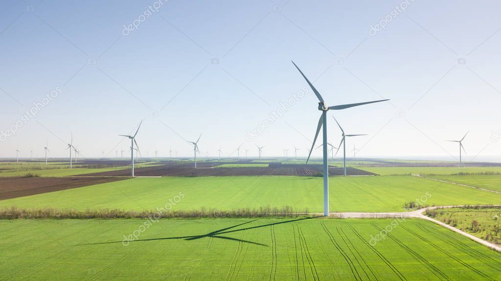 Wind power station on the field. Concept and idea of alternative energy development