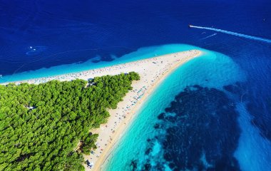 Croatia, Hvar island, Bol. Panoramic aerial view at the Zlatni Rat. Beach and sea from air. Famous place in Croatia. Summer seascape from drone. Travel - image clipart