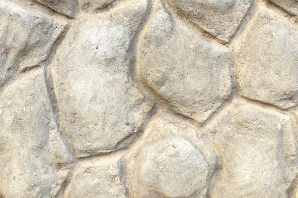 Decorative border of the building facade made of concrete in the form of large stones — Stock Photo, Image