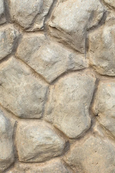 Dekoracyjna granica elewacji budynku wykonana z betonu w postaci dużych kamieni — Zdjęcie stockowe