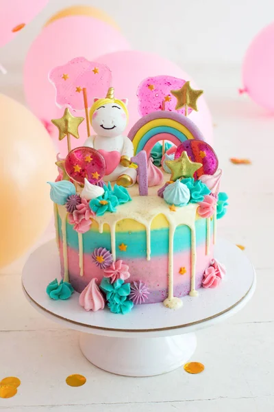 Party cake with unicorn for first birthday