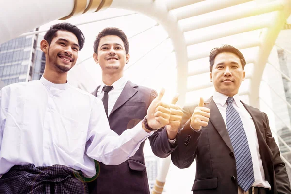 Group of business people joining hand