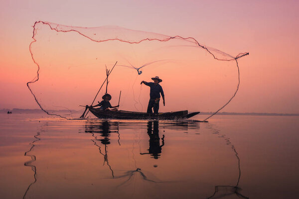 Fishermen using nets to catch fish