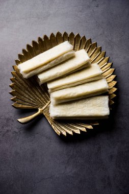 Pootharekulu  is a popular recipe originated from Andhra Pradesh, India.It is a paper-thin sweet or dessert made from rice start/gram flour, jaggery/sugar and clarified butter. Served in a plate.