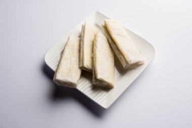 Pootharekulu  is a popular recipe originated from Andhra Pradesh, India.It is a paper-thin sweet or dessert made from rice start/gram flour, jaggery/sugar and clarified butter. Served in a plate.