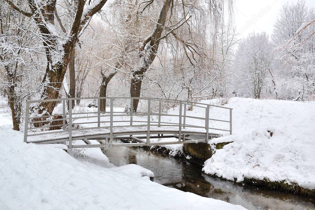 Bridge over a small river in winter.