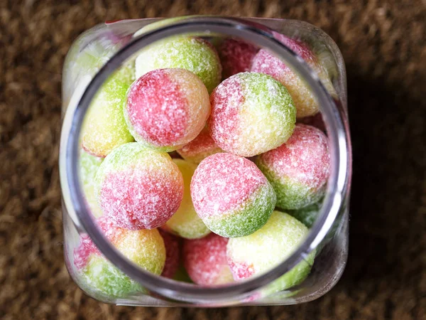 Glass jar with sweets inside