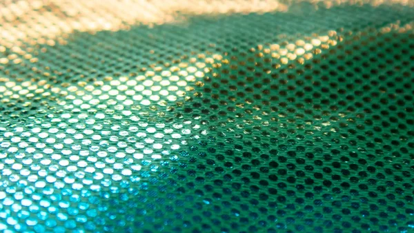 Sıradışı bir yapısı olan parlak soyut bir arkaplan. Gelecekteki ruh hali ve materyal. gökkuşağı rengi 