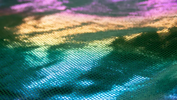 Sıradışı bir yapısı olan parlak soyut bir arkaplan. Gelecekteki ruh hali ve materyal. gökkuşağı rengi 