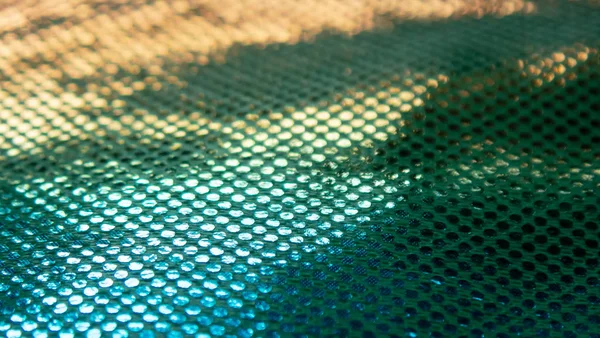 Sıradışı bir yapısı olan parlak soyut bir arkaplan. Gelecekteki ruh hali ve materyal. gökkuşağı rengi 