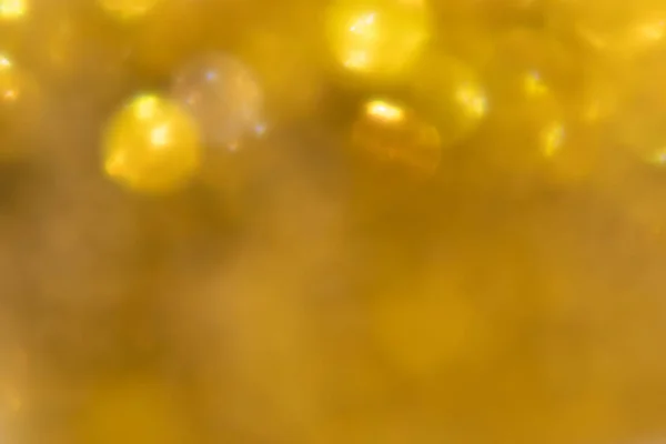 Bokeh ve parlak arkaplanlı parlak bir ışık. Dokulu yardım tuvali, lüks, yeraltı, gümüş arkaplan. 