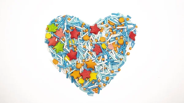 Heart Background from sugar figurines such as confetti, caramel, candy. Ideal symbol of love, st Valentine, romantic  