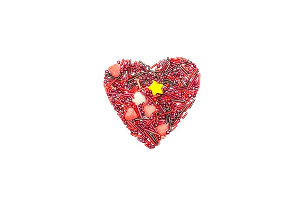 Heart Background from sugar figurines such as confetti, caramel, candy. Ideal symbol of love, st Valentine, romantic  