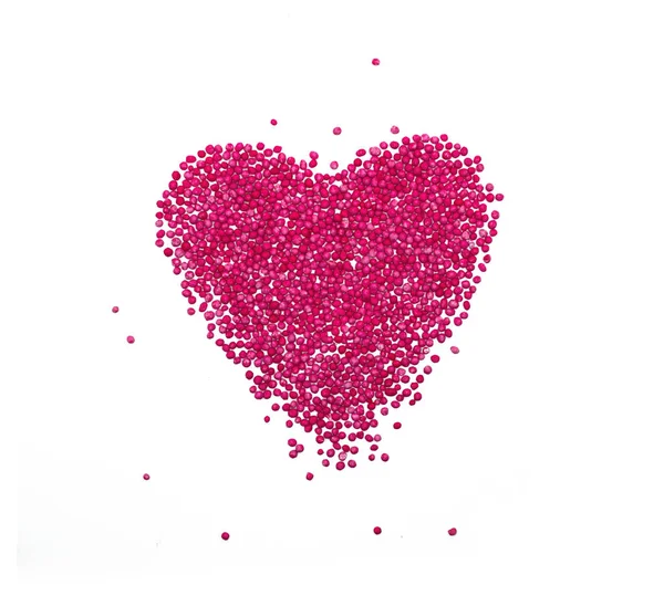 Heart Background from sugar figurines such as confetti, caramel, candy. Ideal symbol of love, st Valentine, romantic  