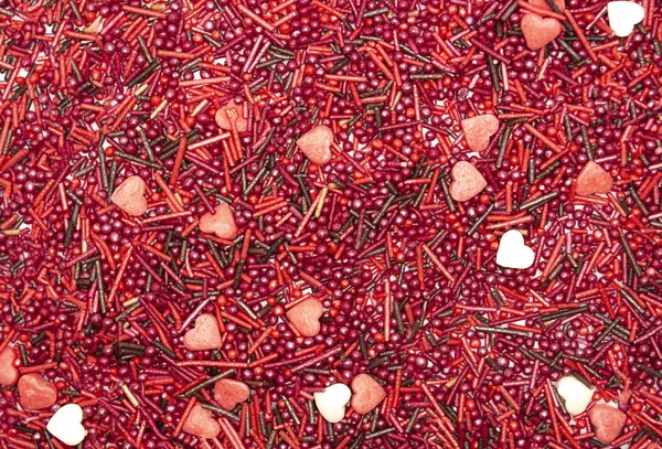 Heart blur Background from sugar figurines such as confetti, caramel, candy. Ideal symbol of love, st Valentine, romantic  