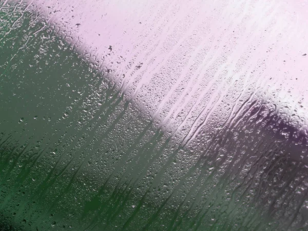 Textur Ett Vått Glas Med Vattendroppar Droppar Och Blekrosa Gröna — Stockfoto