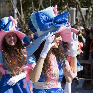 Limassol, Cyprus, March 1st, 2020: Girls in bright carnival costumes enjoying themselves during the Grand Parade of the Annual Limassol Carnival Festival
