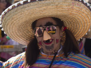 Limassol, Cyprus, March 1st, 2020: Close-up of a smiling woman in a Mexican style carnival costume taking part in the Grand Parade of the Annual Limassol Carnival Festival