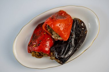 Tasty lunch, stuffed peppers and eggplant clipart