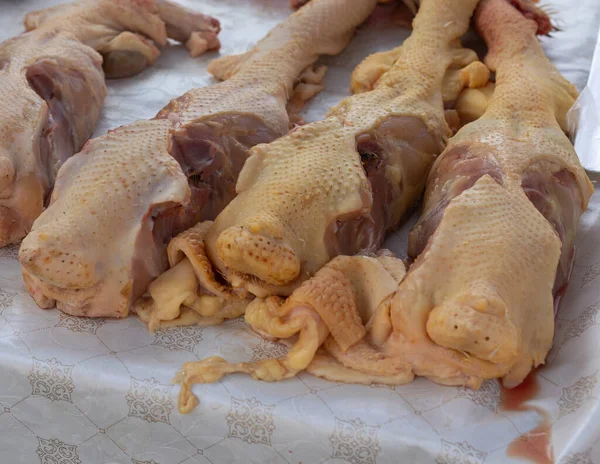 Turkey meat on counter for sale.