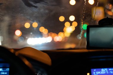 In a car in winter at night