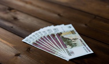 Russian money on a wooden background